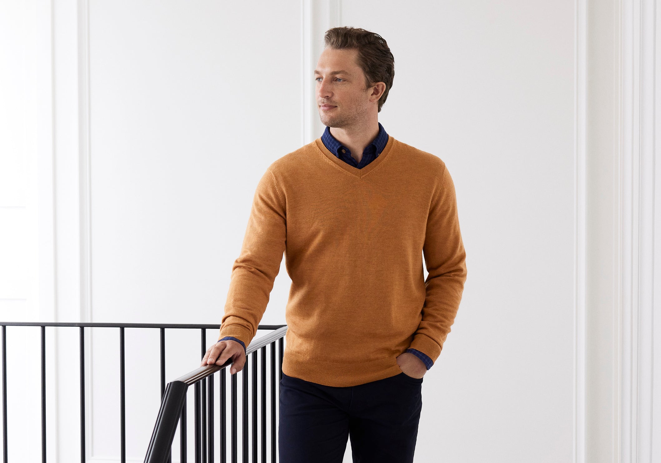 The Proper Way to Pull Off a T-Shirt with a V-Neck Sweater